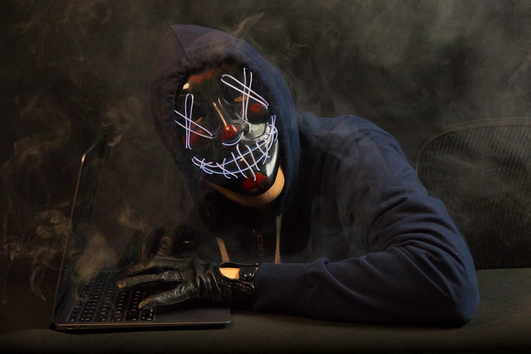 Cybercriminal attempting to steal passwords and personal data from computer screen